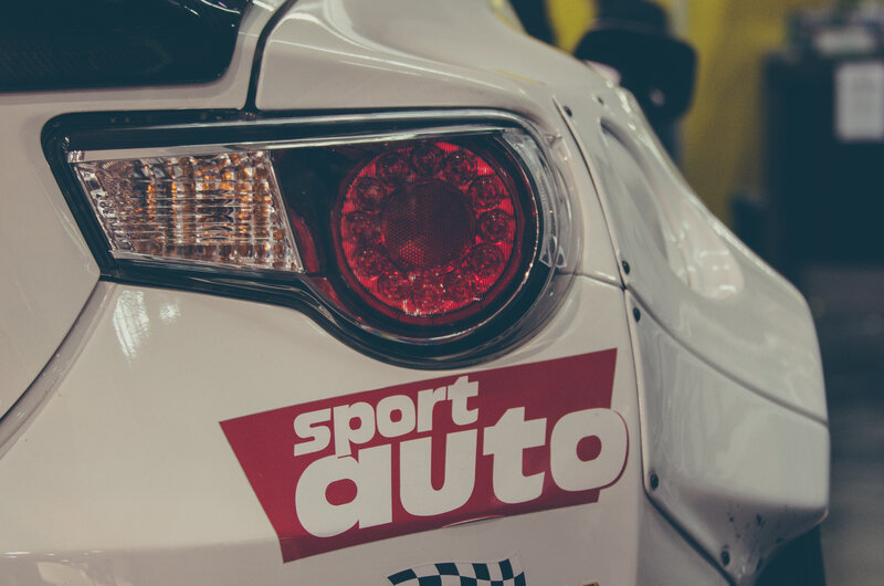 white car with sport auto sticker