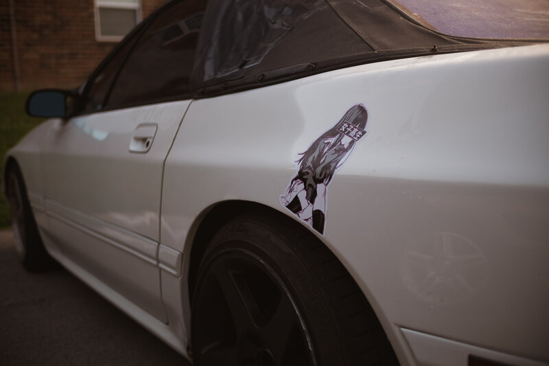 White Car with Sticker