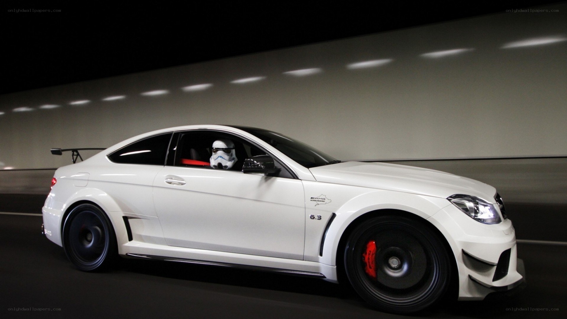 white car with stormtrooper driver