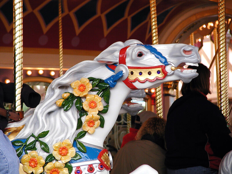 White carousel horse with flowers