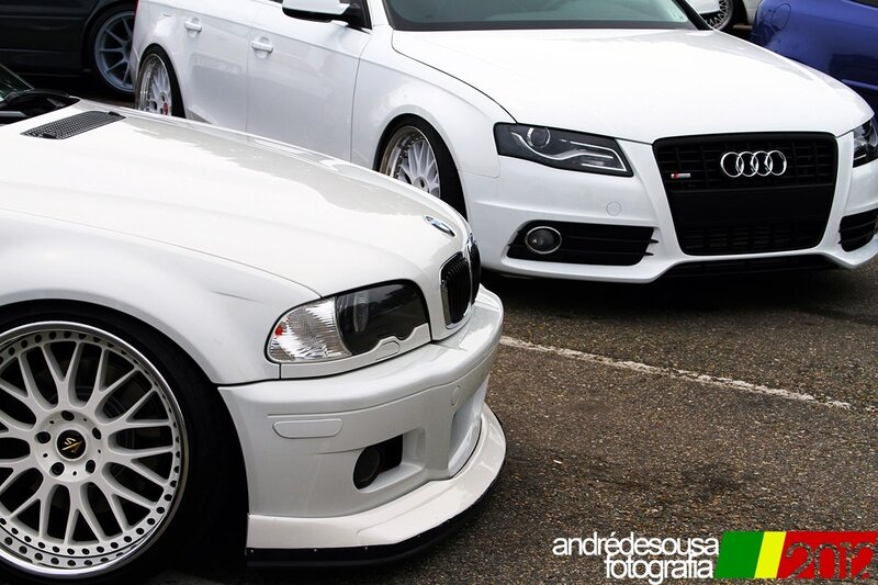 White cars at a car show