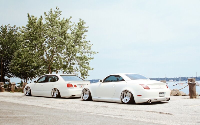 White cars by the water