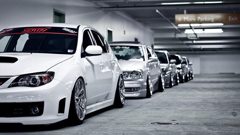 white cars in parking garage