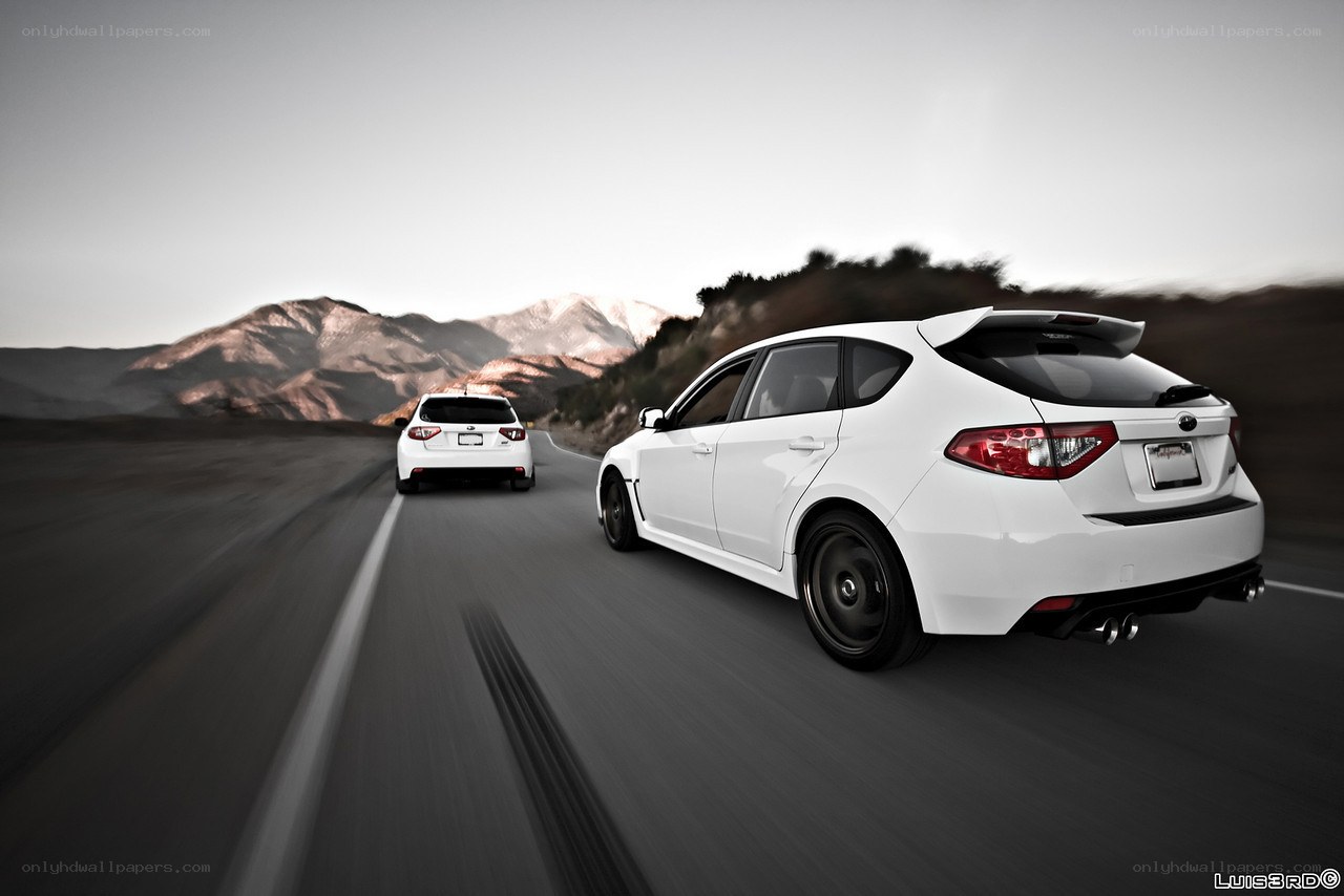 White cars on mountain road