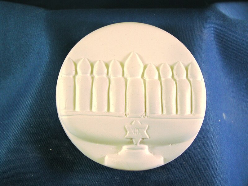 White ceramic menorah medallion