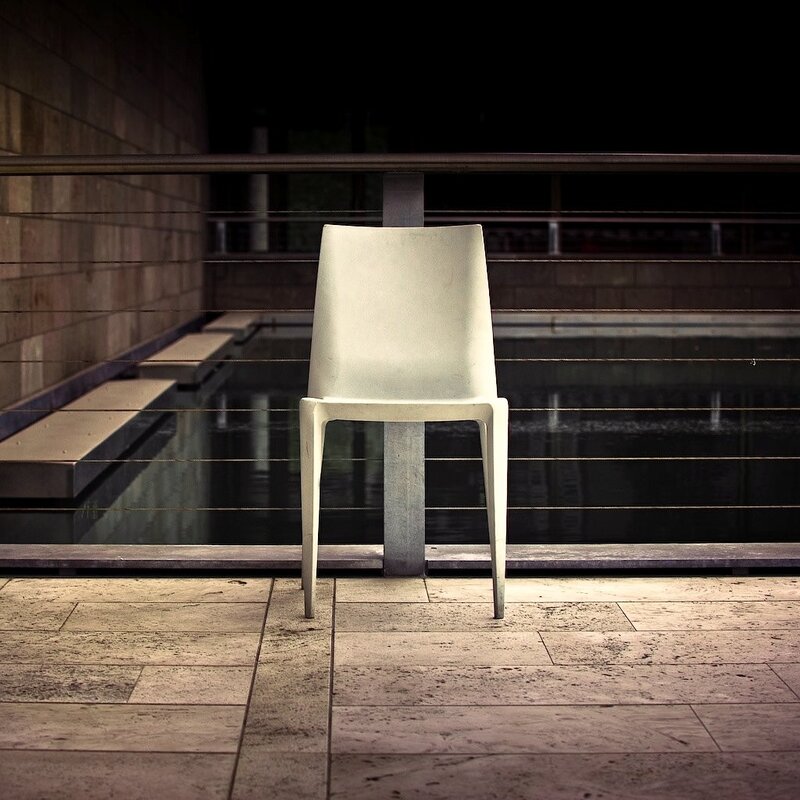 White chair by a pool