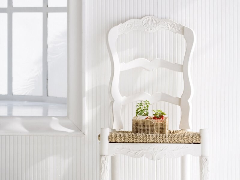White chair with plants