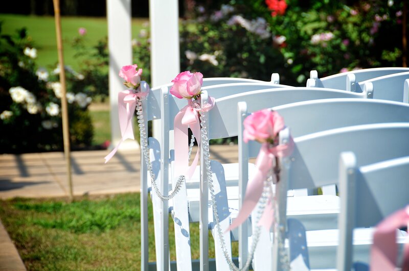 White Chairs with Pink Roses