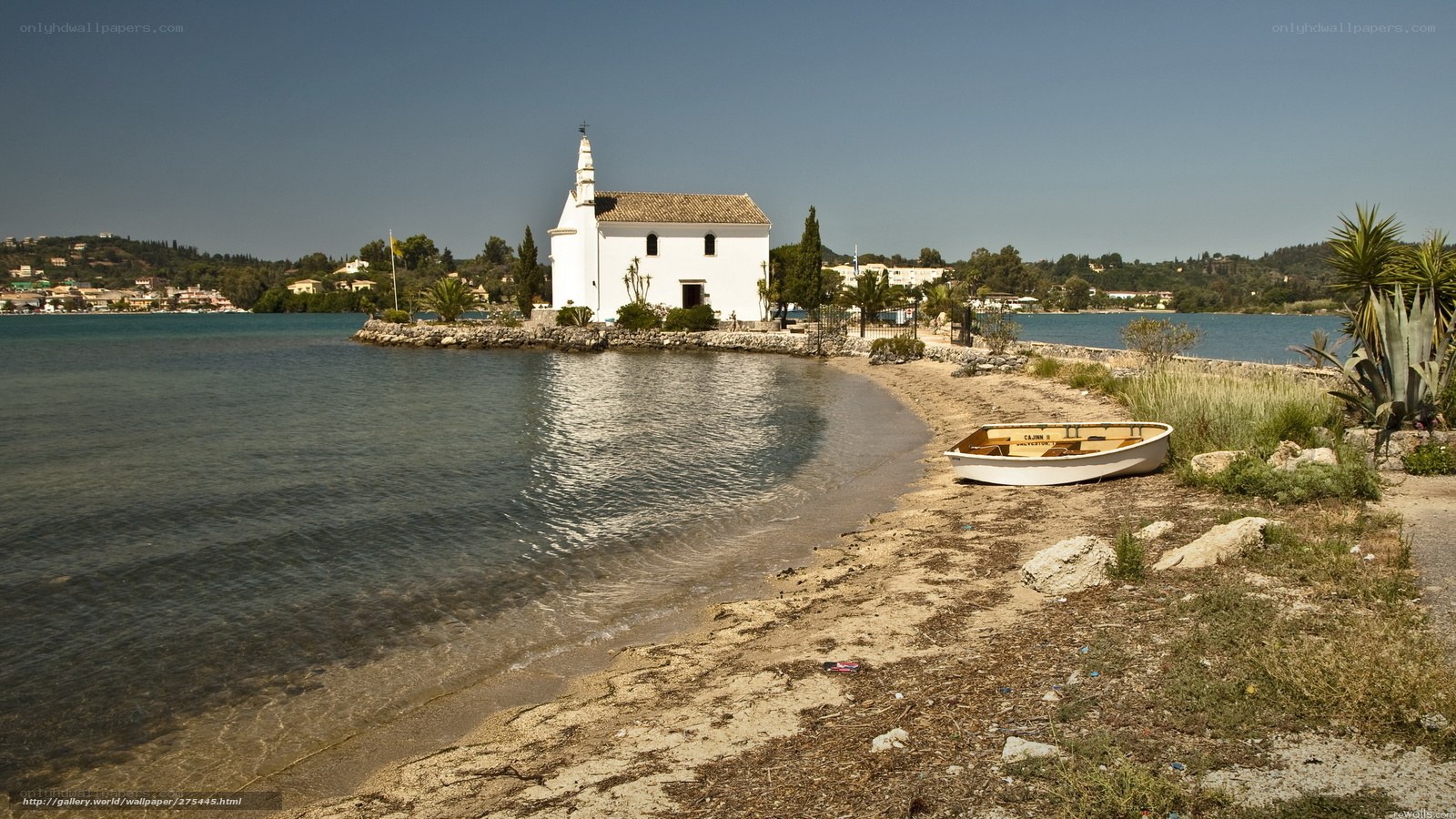White chapel on a lakeside peninsula