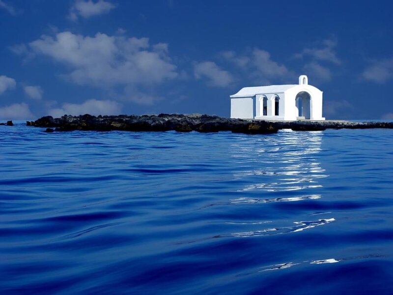 White chapel on rocky island