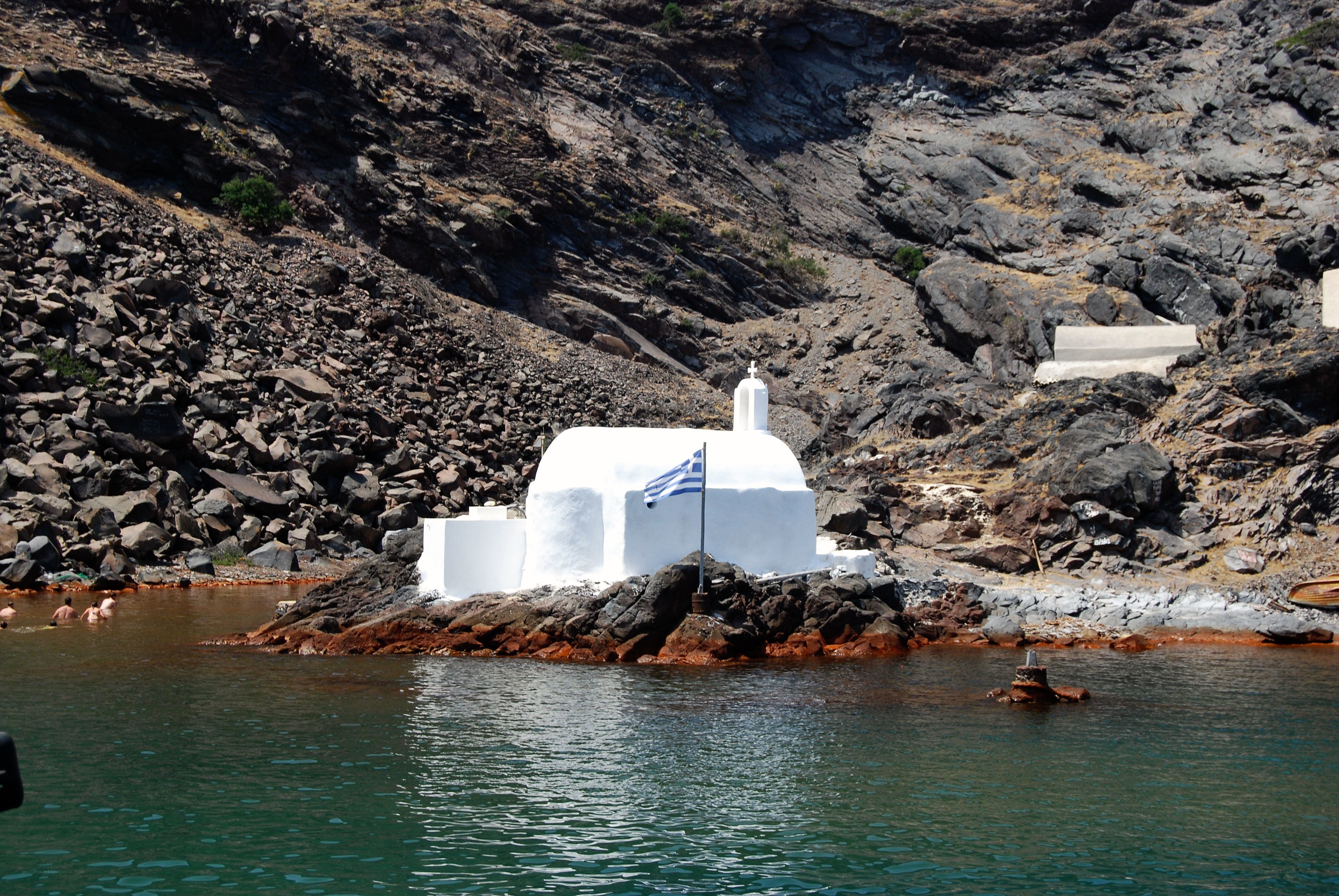 White chapel on rocky shore