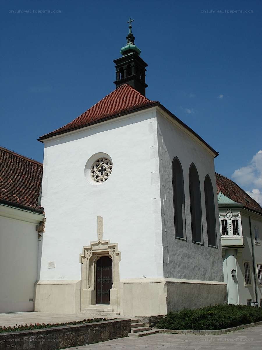 White chapel with green spire