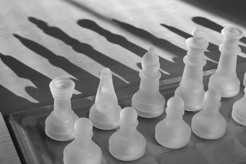White Chess Pieces — Black, Dramatic