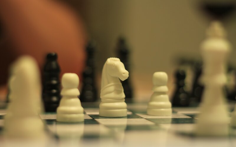White Chess Pieces — Focused