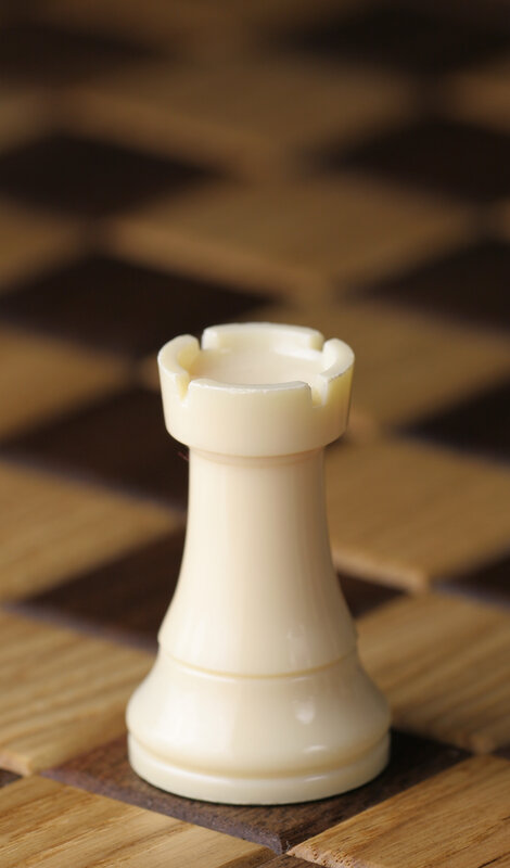 white chess rook on board