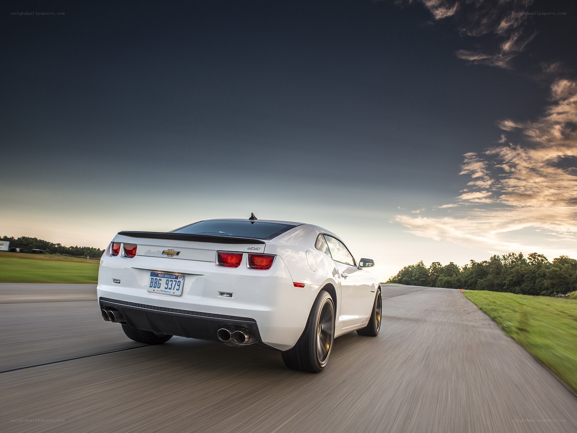 white chevrolet camaro driving