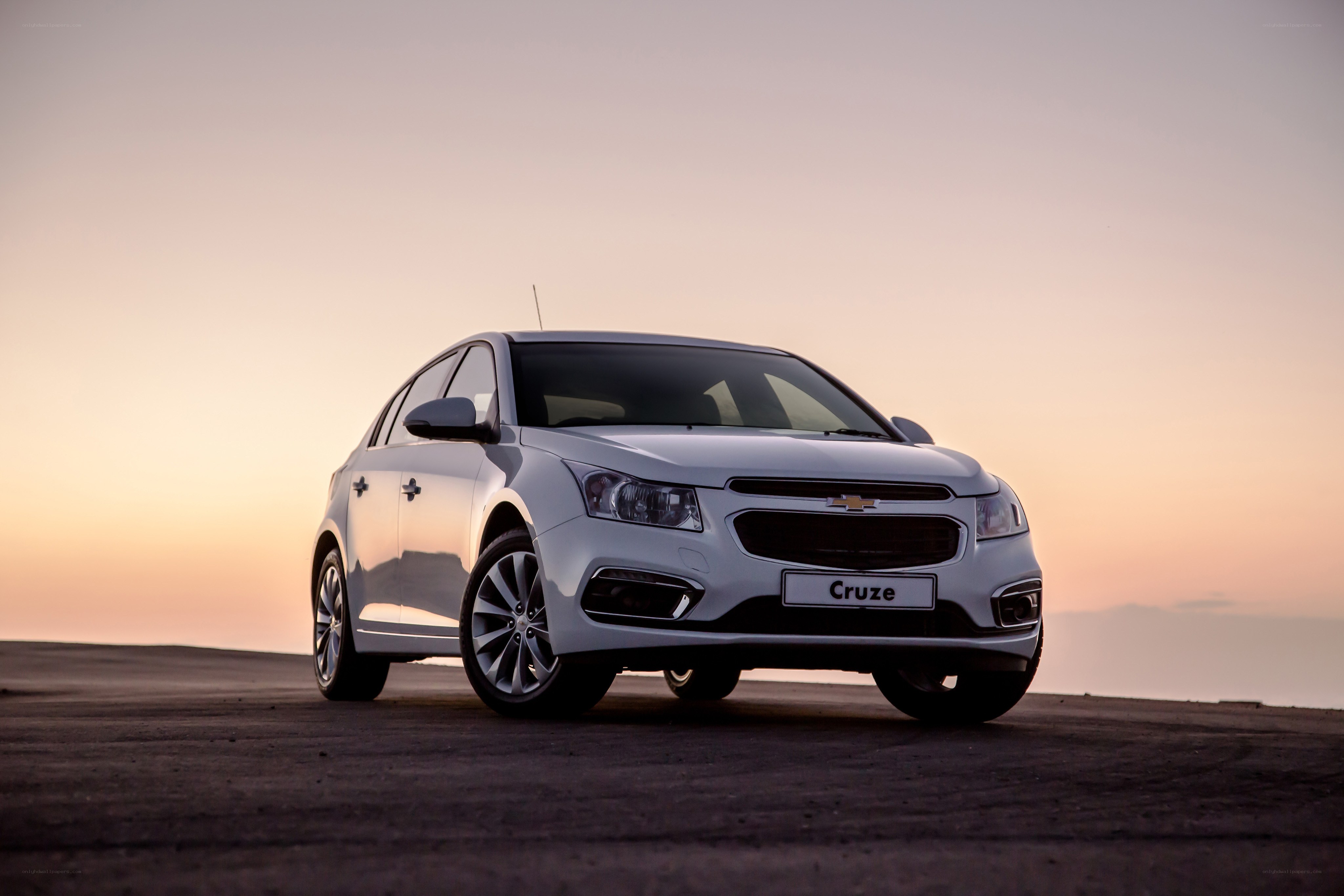 White Chevrolet Cruze at sunset