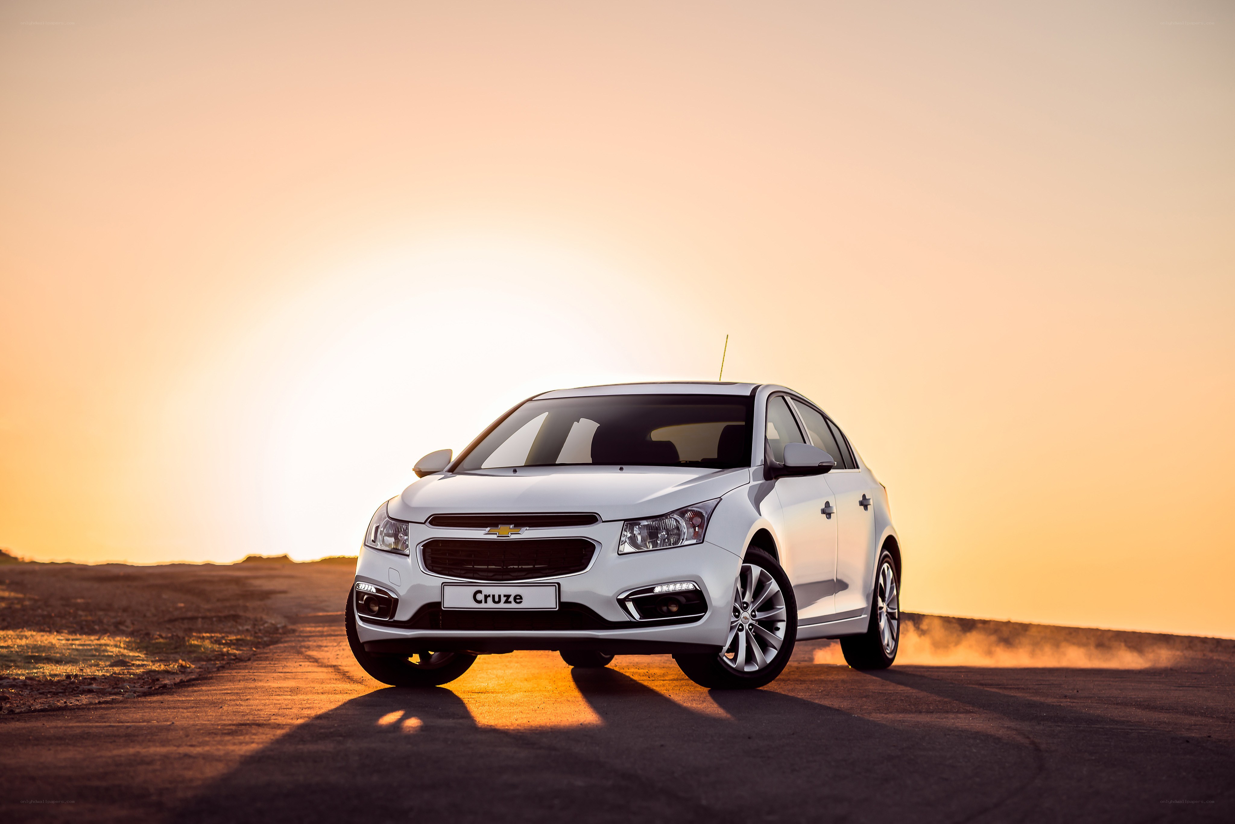 White Chevrolet Cruze at sunset
