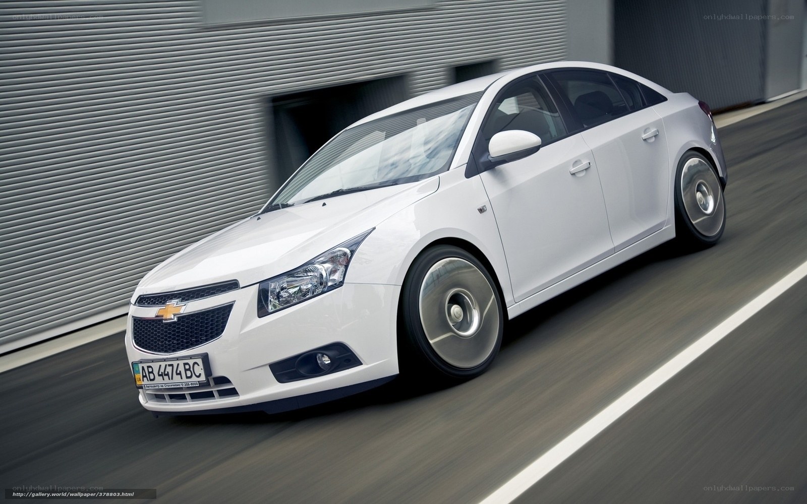 White Chevrolet Cruze in motion