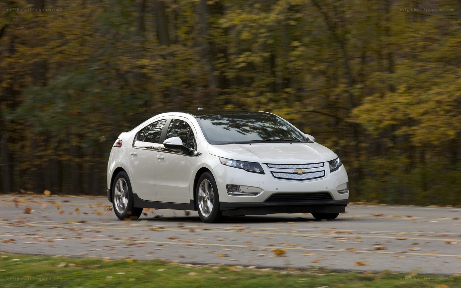 White Chevrolet Volt driving on road
