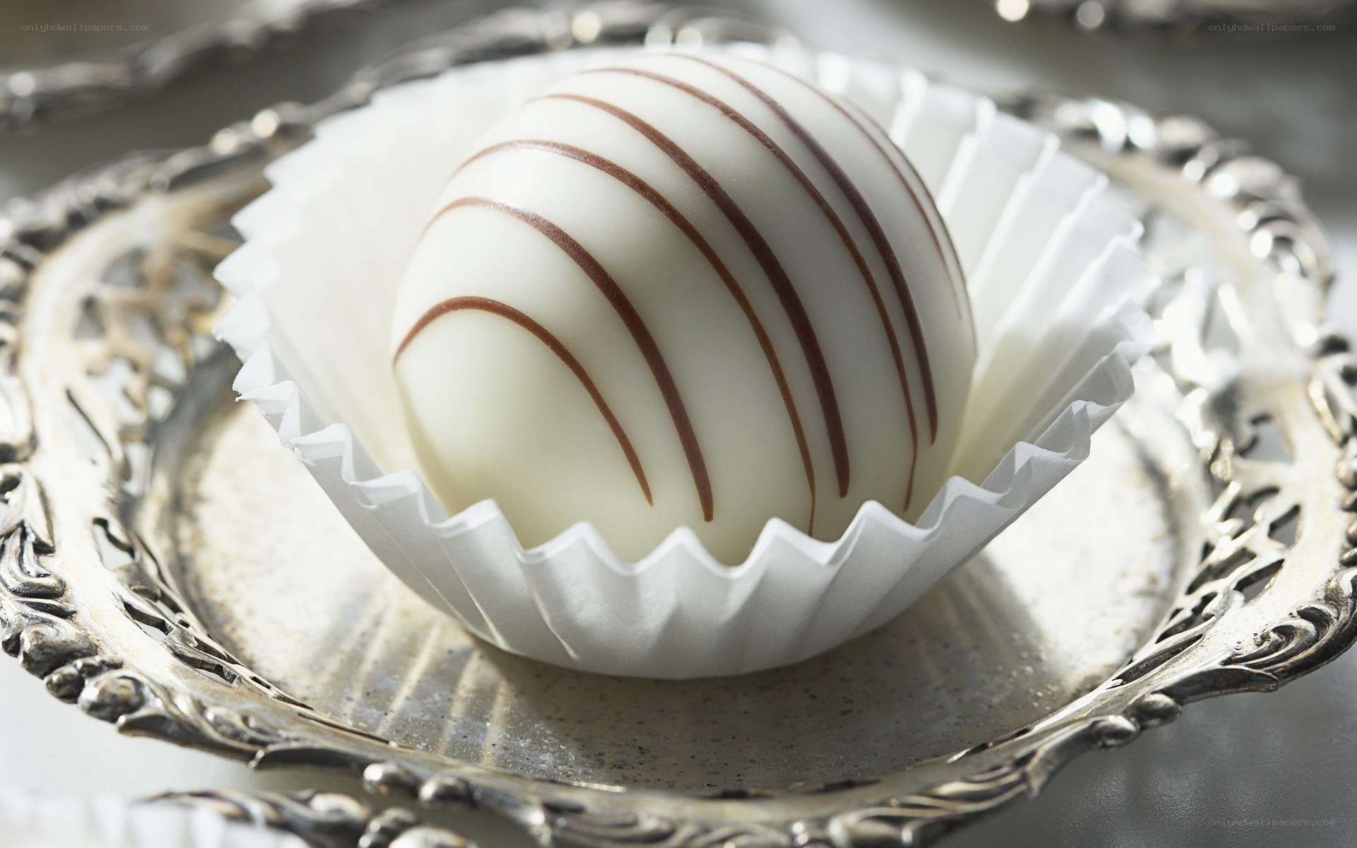 white chocolate truffle on silver tray