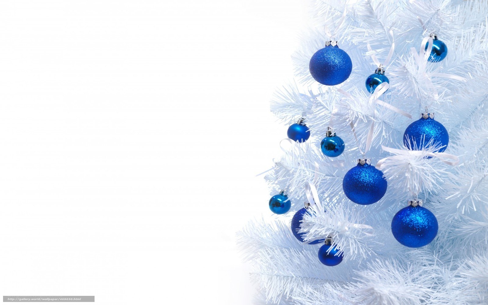 white christmas tree with blue ornaments