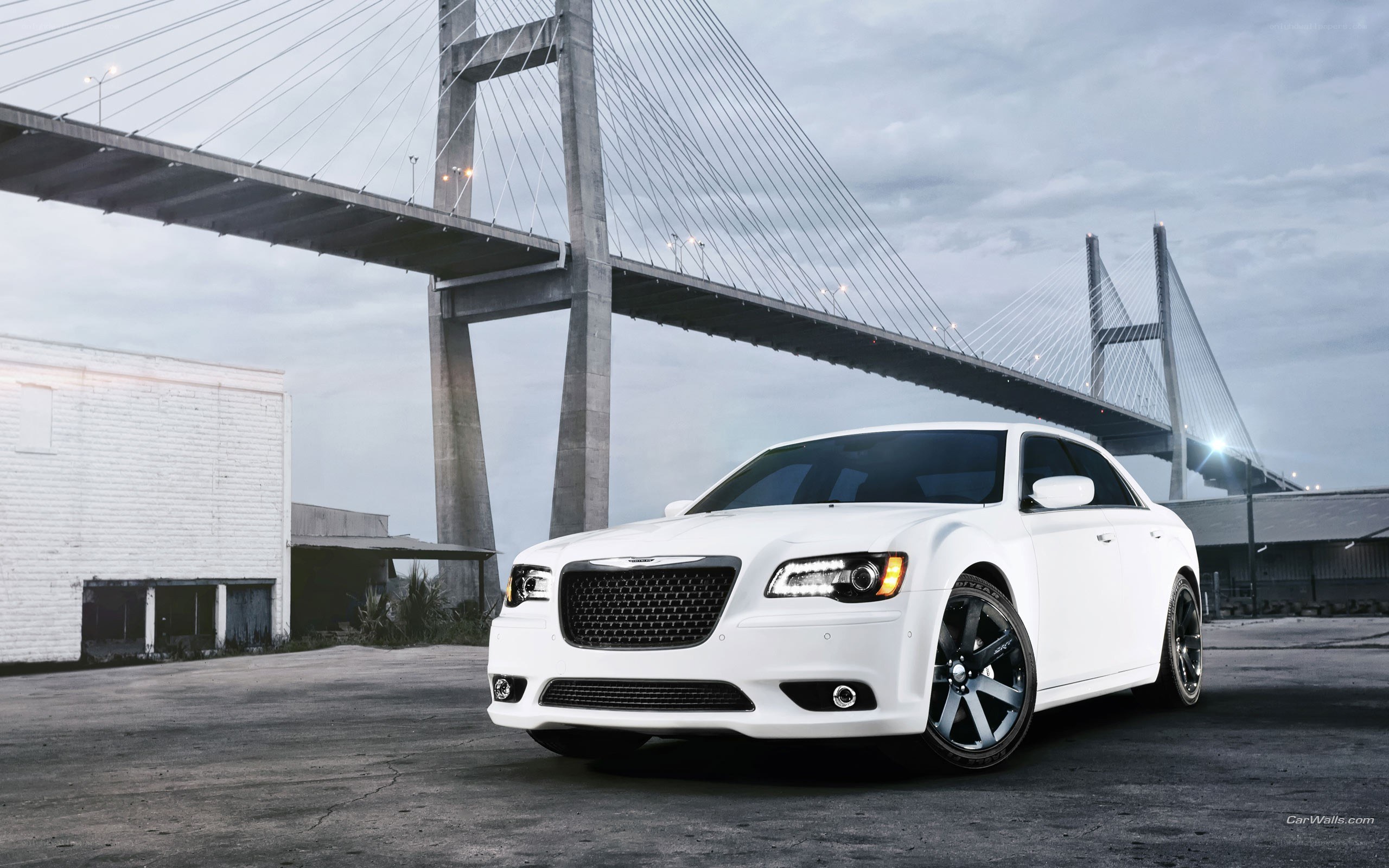 White Chrysler 300 by a bridge