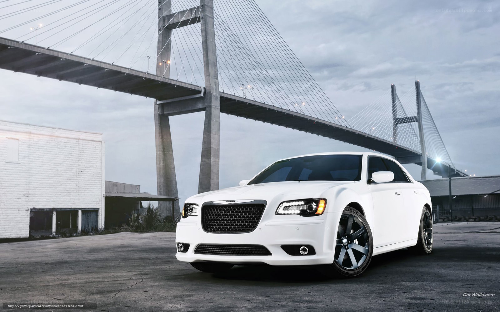 White Chrysler 300 by a bridge