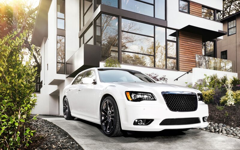 White Chrysler 300 in modern driveway