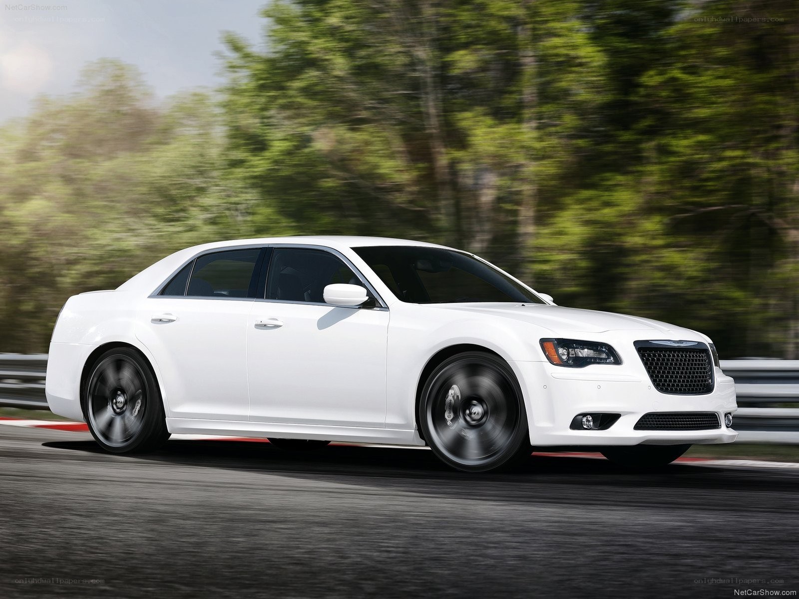 white chrysler 300 in motion