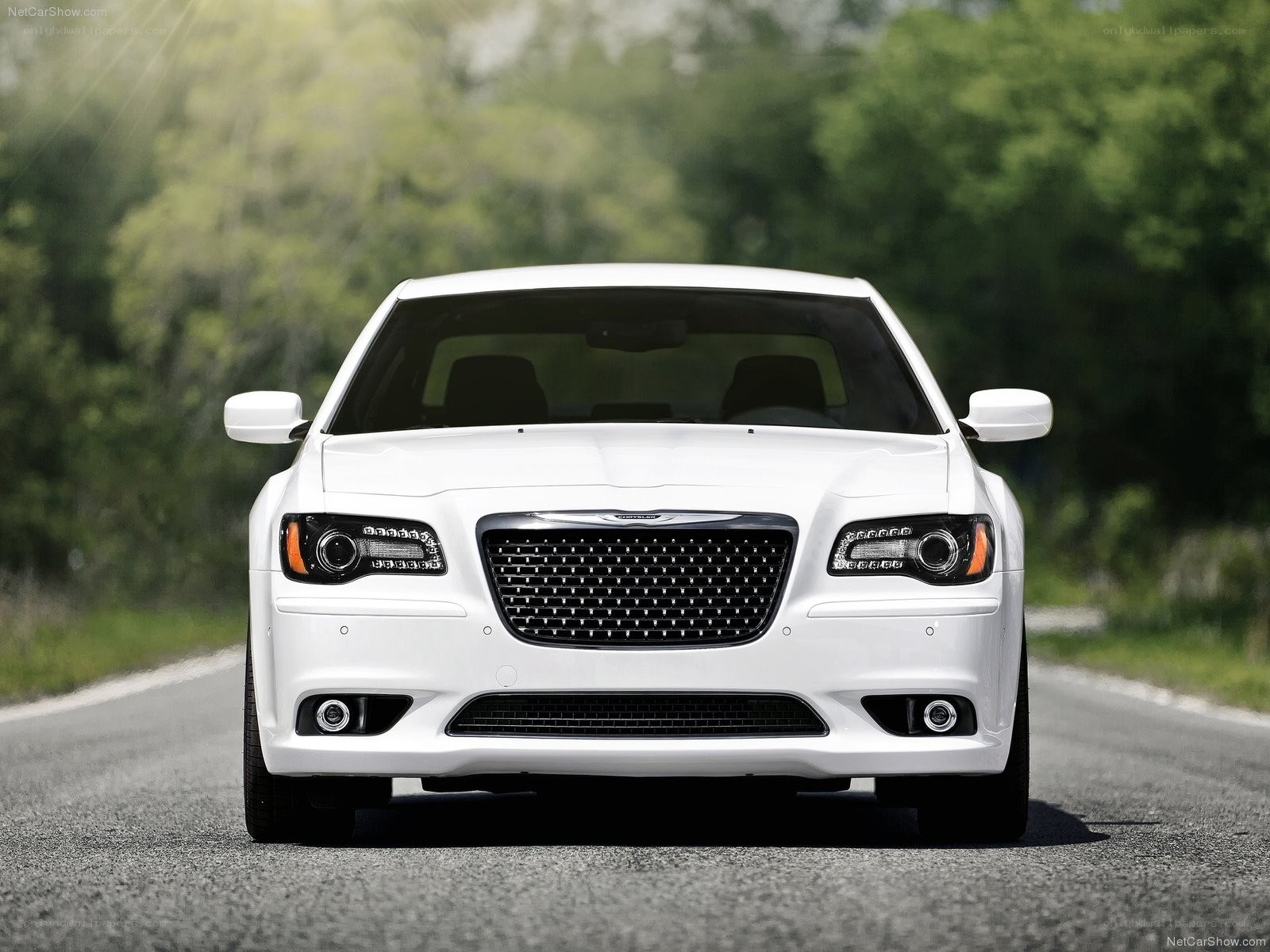 white chrysler 300 on road