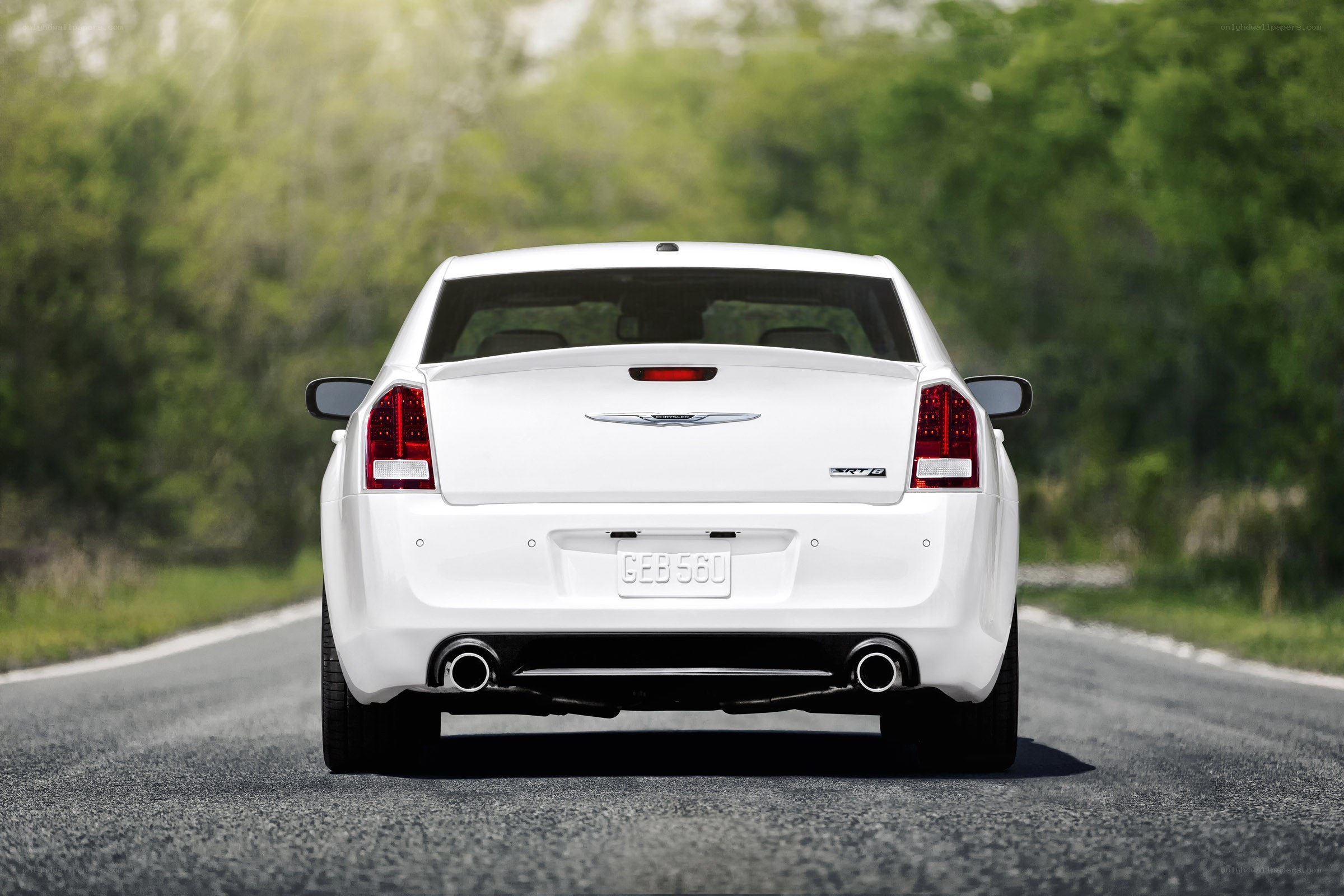 white chrysler 300 on road