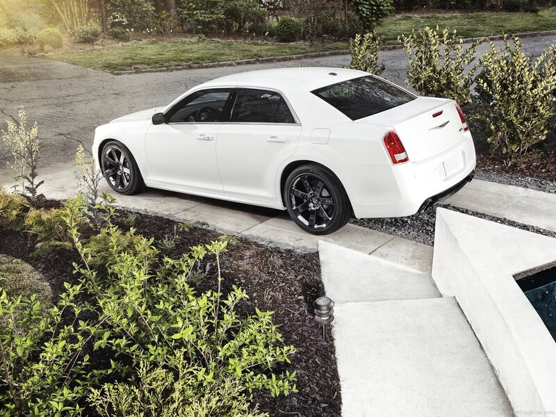 White Chrysler 300 parked in driveway