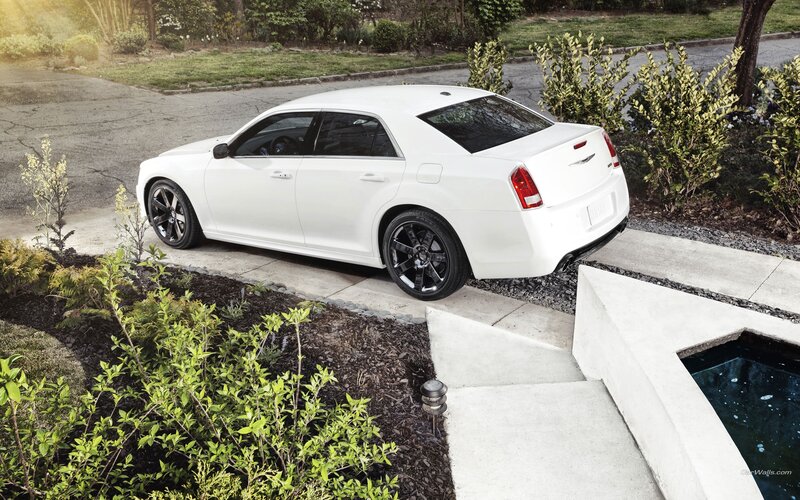 White Chrysler 300 parked in garden