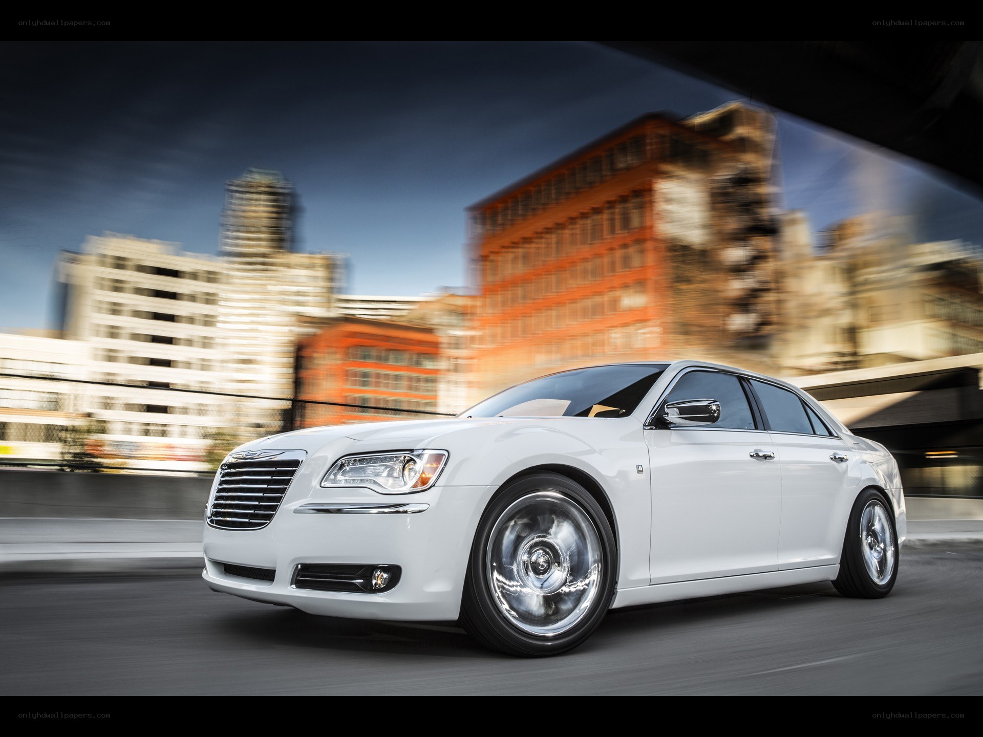 White Chrysler driving in city