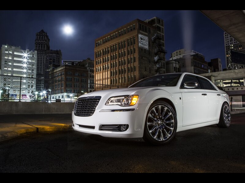 White Chrysler in city at night