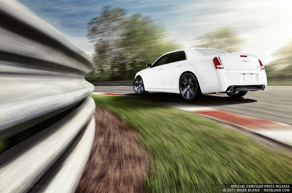 White Chrysler on a racetrack