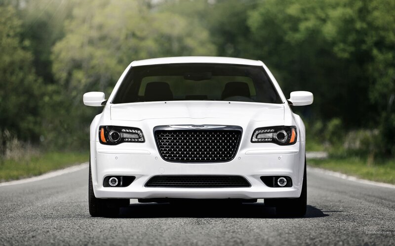 white chrysler on a road