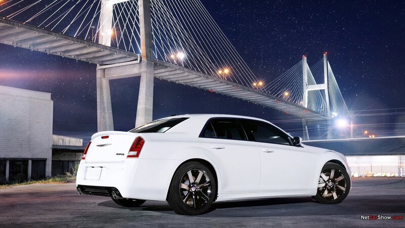 White Chrysler sedan at night