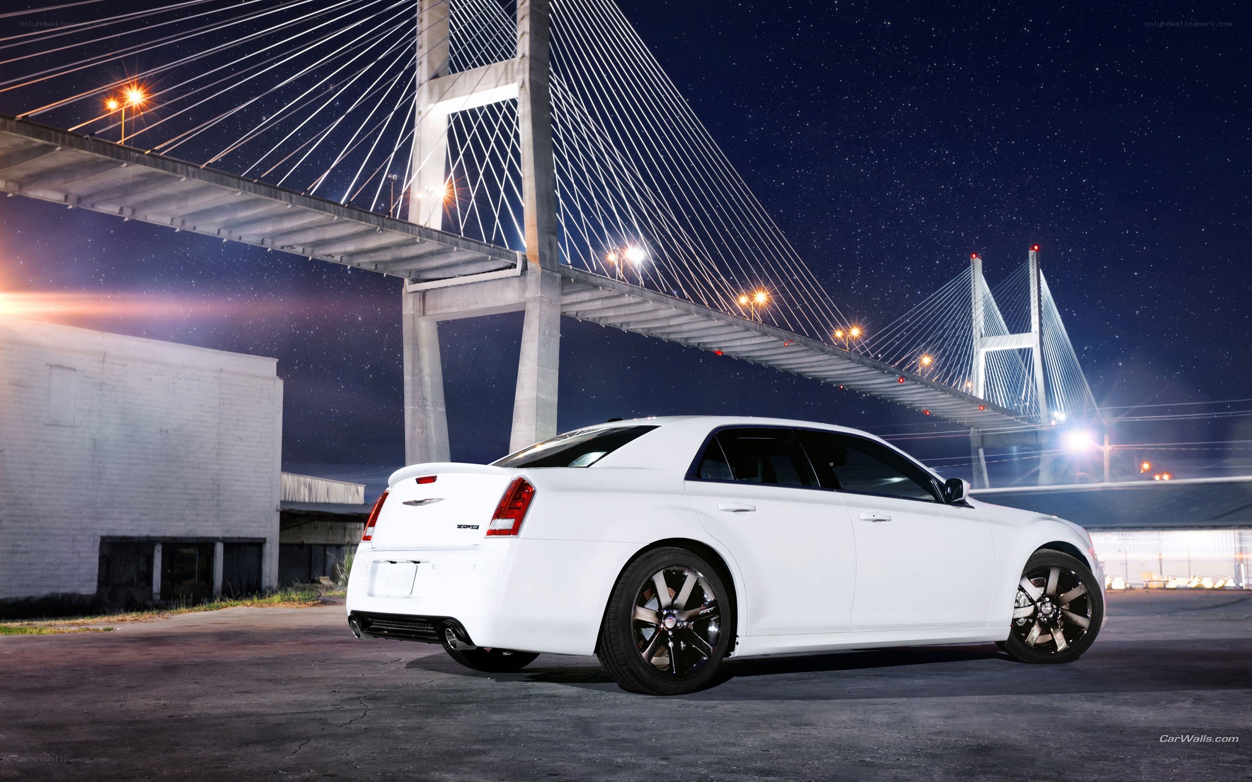 White Chrysler sedan at night