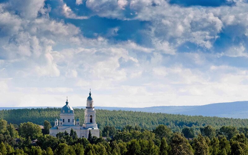 White church in forest landscape
