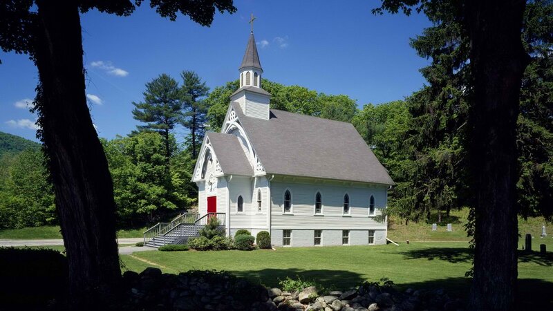 White church in green landscape