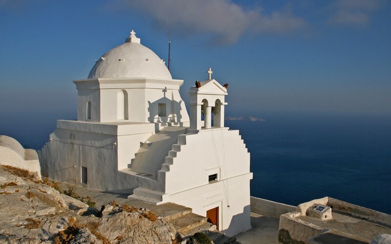 White church on a cliff overlooking the sea