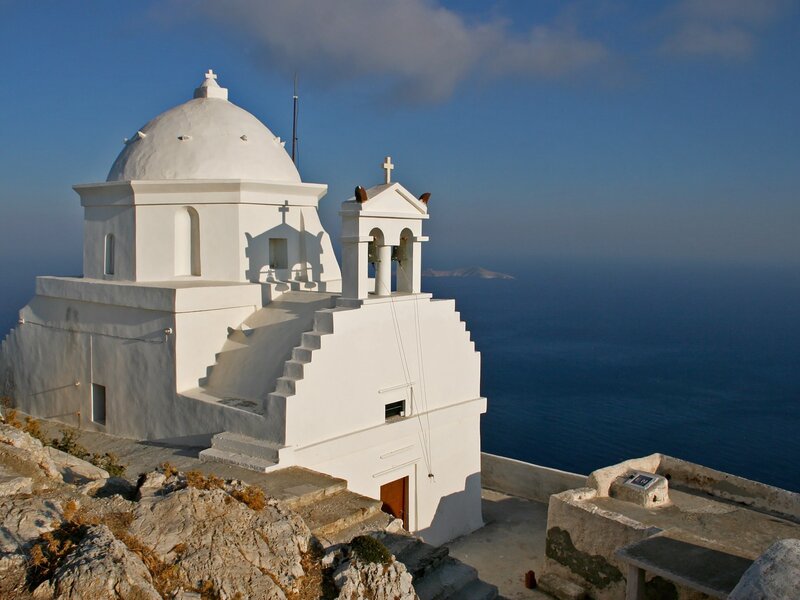 White church on a cliff overlooking the sea