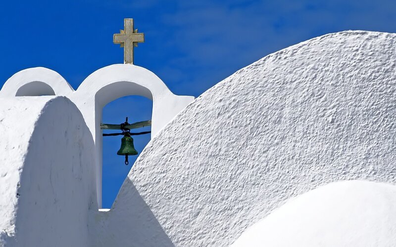White church with bell and cross