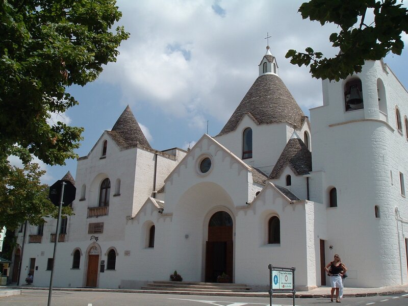 white church with conical roofs