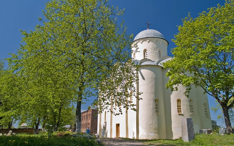 White church with dome and trees