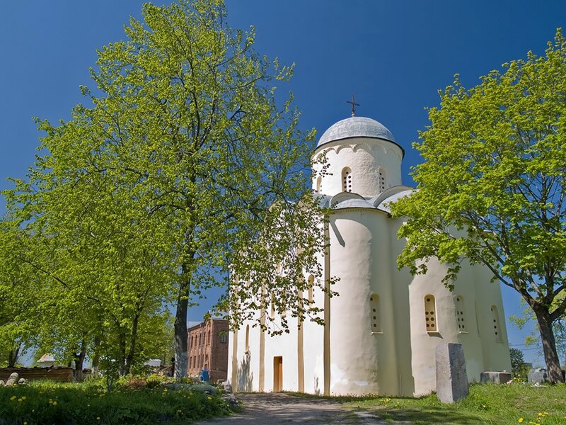 White church with dome and trees