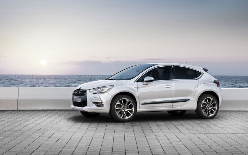 White Citroën DS4 by the sea