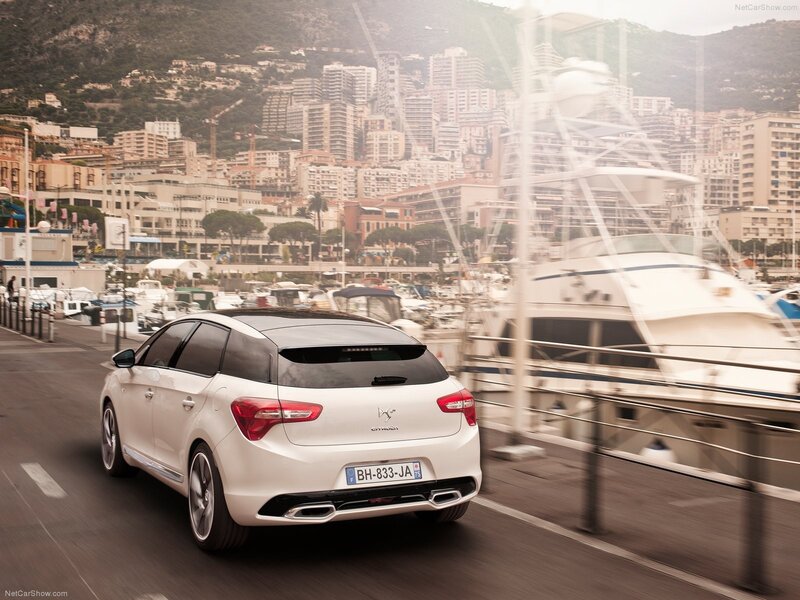 White Citroën DS4 driving by a marina